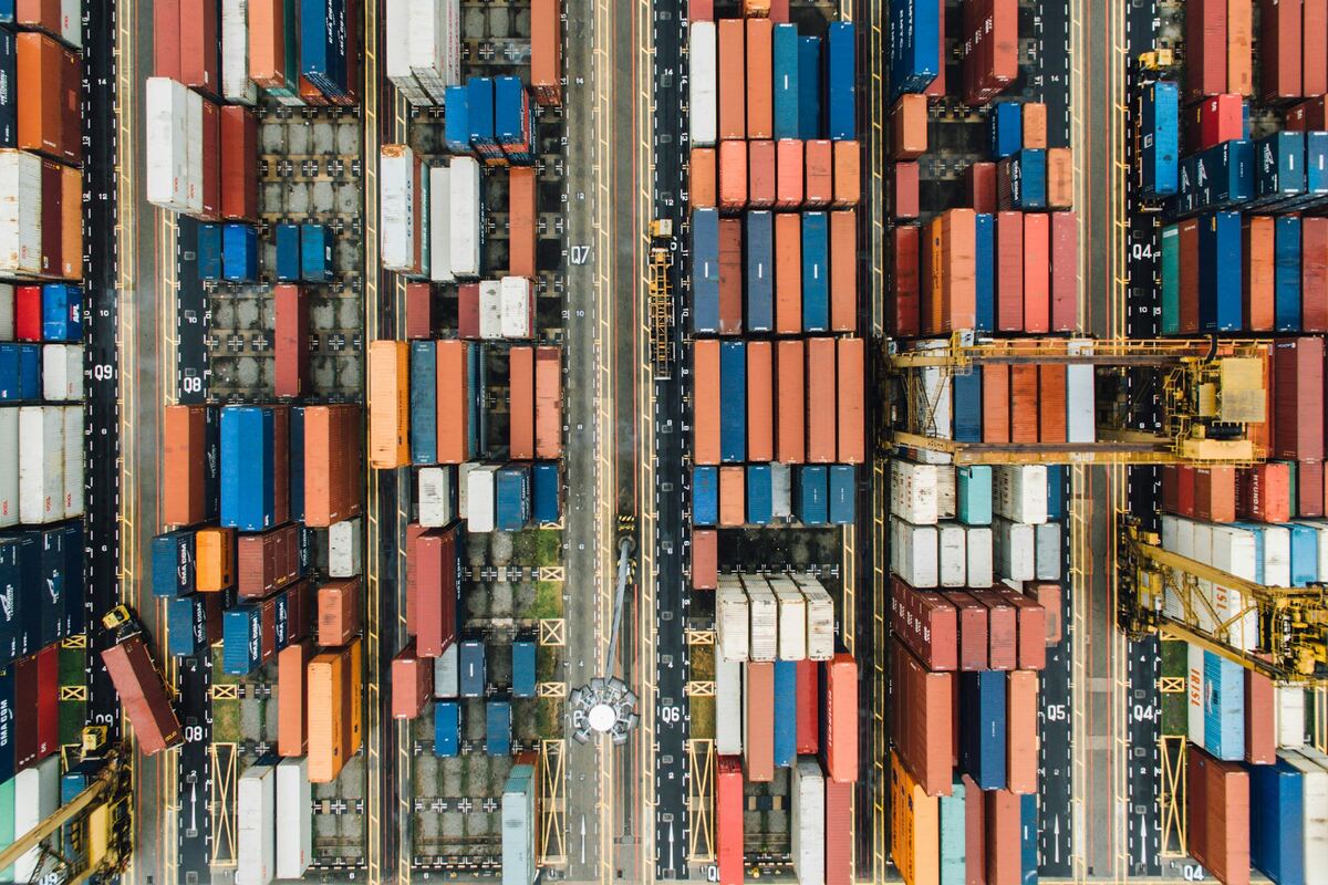 Organized rows of shipping containers at a port