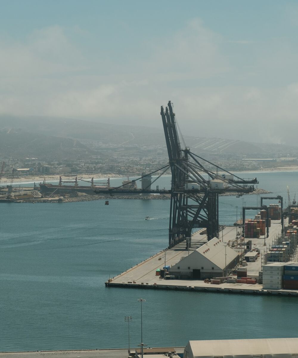 Cargo vessel operating at an industrial seaport